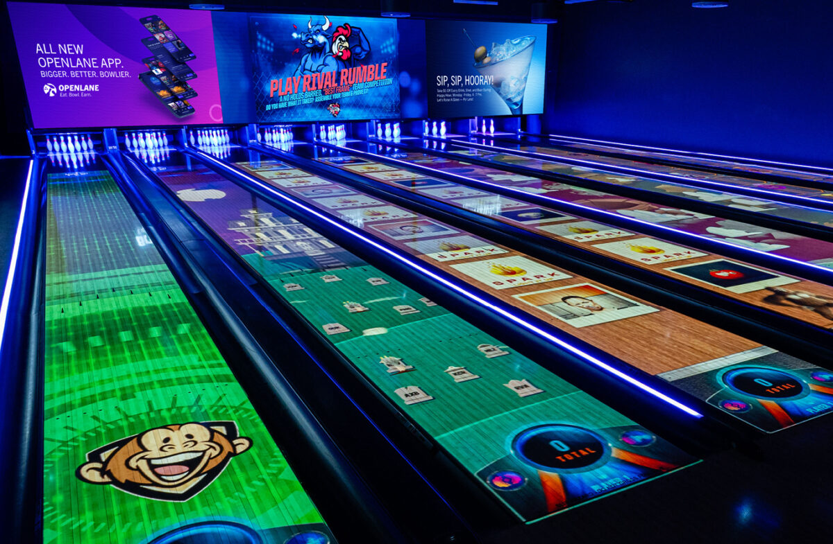 Actual modern bowling lanes illuminated with immersive SPARK-style projection effects